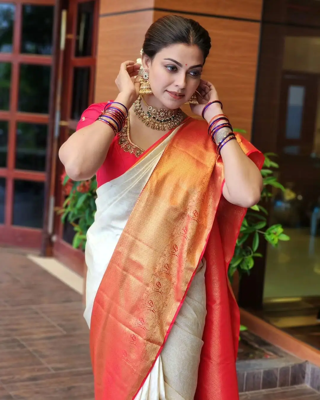 Anusree Nair Wearing Beautiful Earrings Jewellery White Saree Orange Blouse